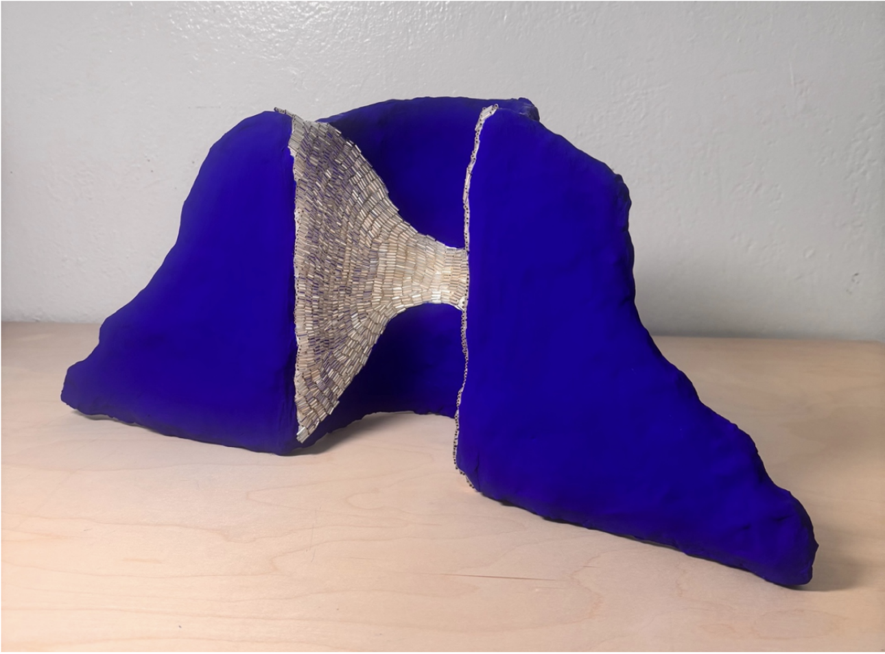 deep blue painted abstract tabletop sculpture with silver bead lining