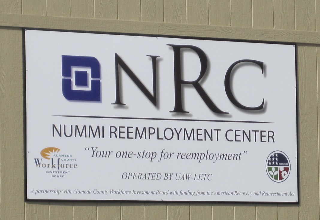 A sign says NUMMI Reemployment Center