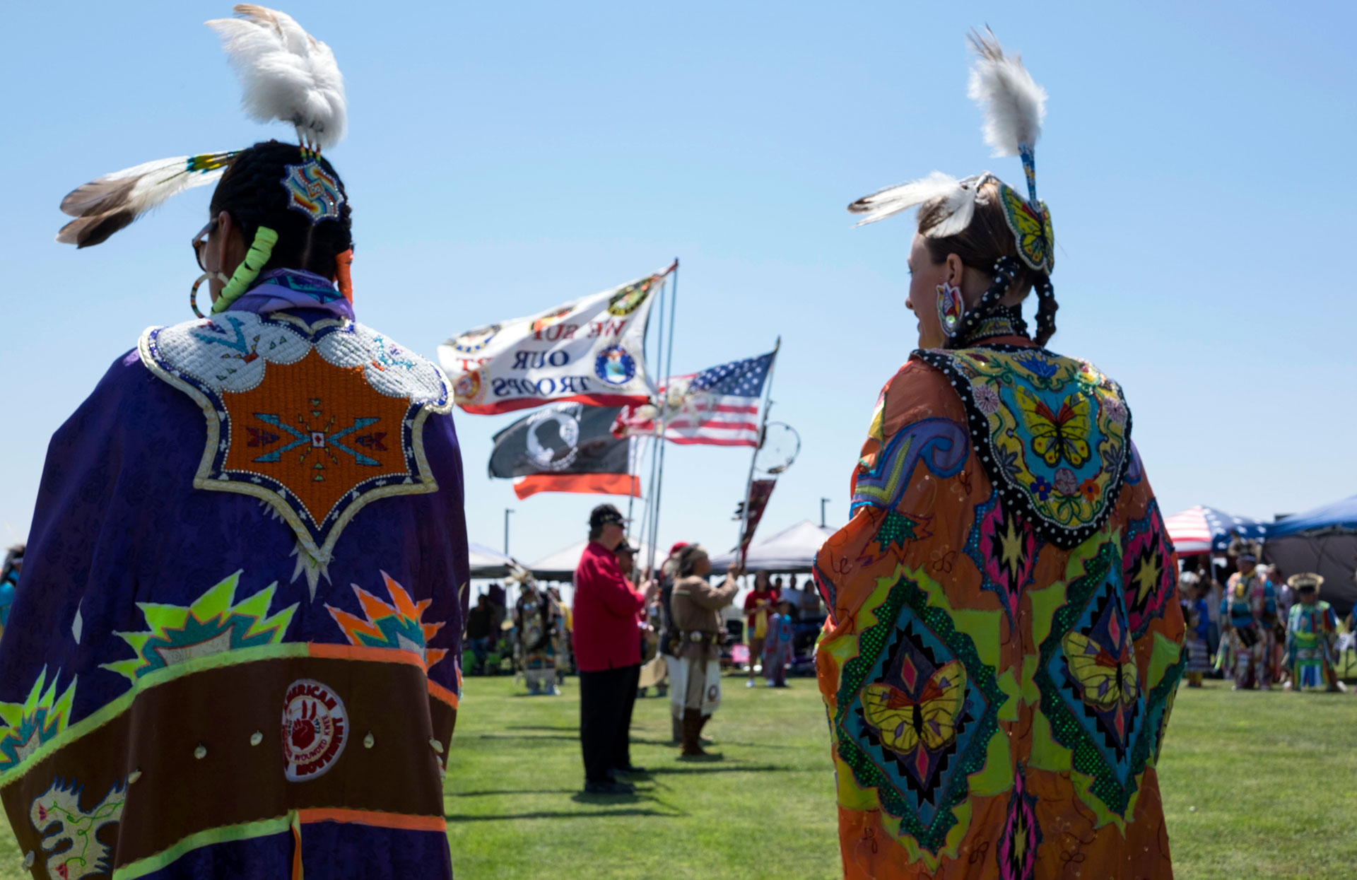Helen Gaddie (L) stands inside the dance circle during the Sierra Mono Museum's 45th annual powwow on August 6, 2016.