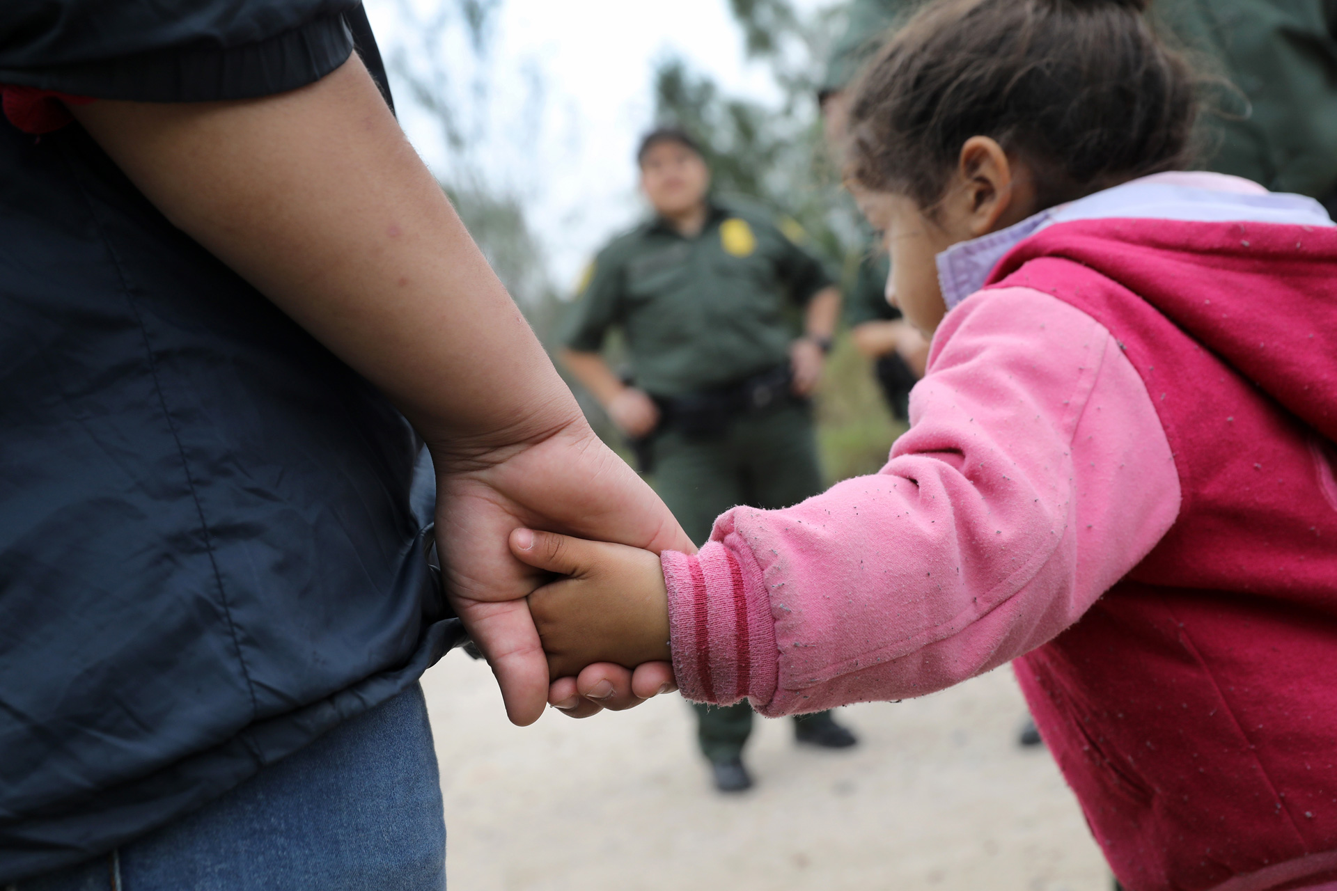 Border Patrol agents take Central American immigrants into custody on January 4, 2017 near McAllen, Texas. Thousands of families and unaccompanied children, most from Central America, are crossing the border illegally to request asylum in the U.S. from violence and poverty in their home countries.