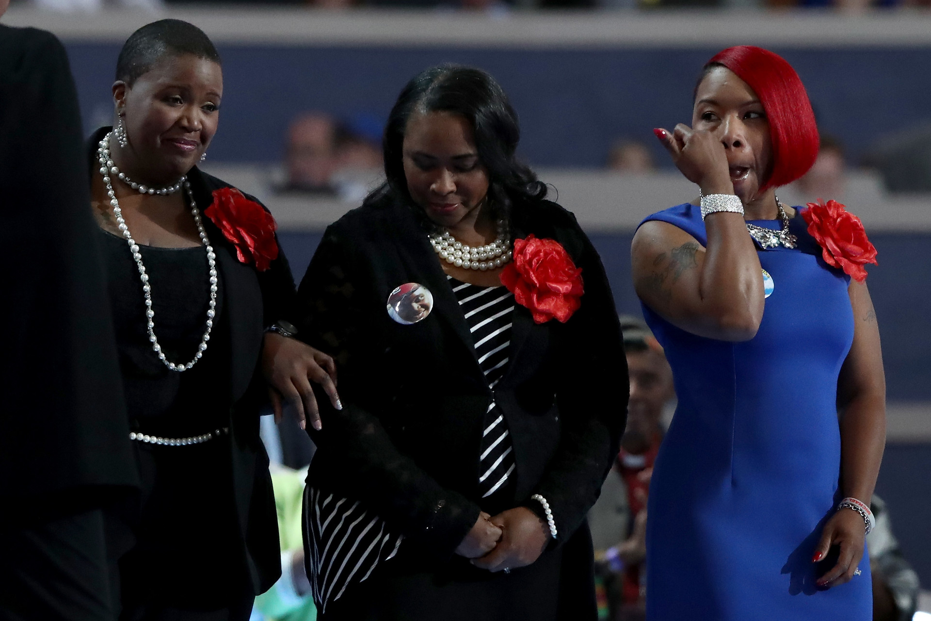 (L-R) Cleopatra Pendleton-Cowley, mother of Hadiya Pendleton; Wanda Johnson, mother of Oscar Grant; and Lezley McSpadden, mother of Mike Brown stand on stage prior to delivering remarks on the second day of the Democratic National Convention at the Wells Fargo Center, July 26, 2016 in Philadelphia, Pennsylvania. Johnson says she talks regularly with other mothers who have lost loved ones to police violence.
