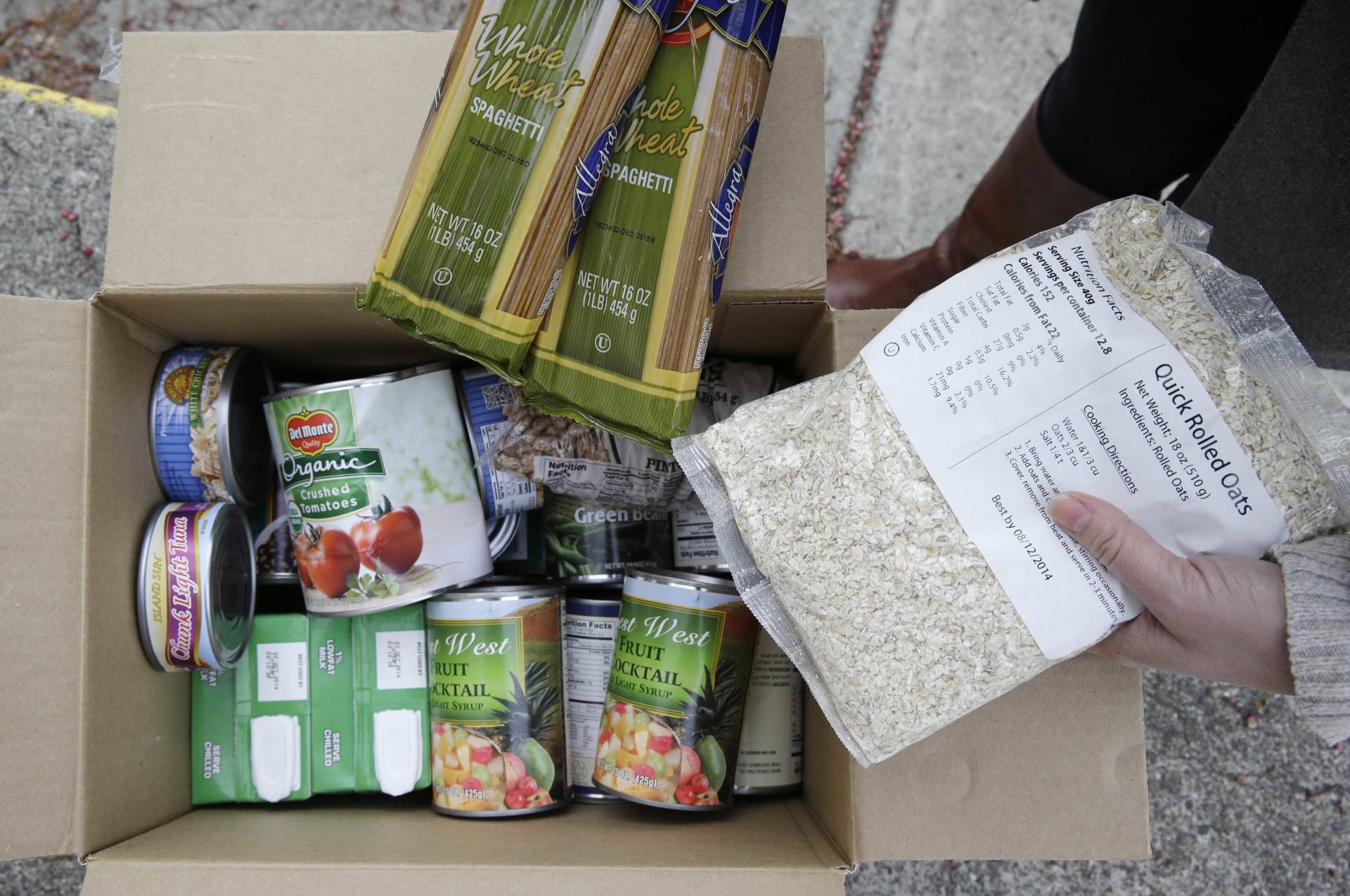 A box of food prepared at a food bank distribution in Petaluma. California ranks near the bottom in enrolling people for food assistance. To change that, it's taking lessons from its robust Medi-Cal health insurance program, which targets much the same population.