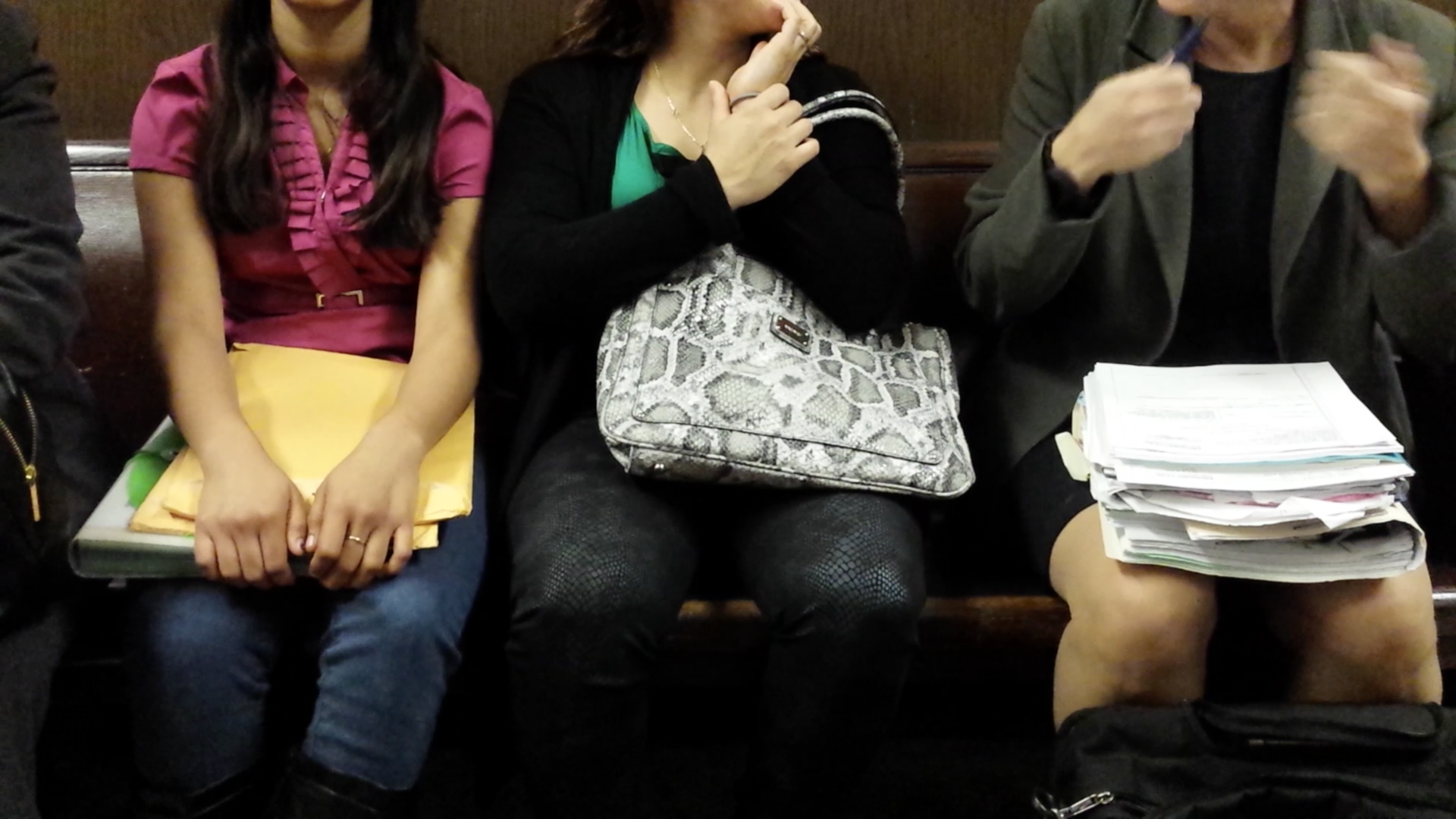 Young immigrants wait to enter a San Francisco courtroom for a hearing in 2014.