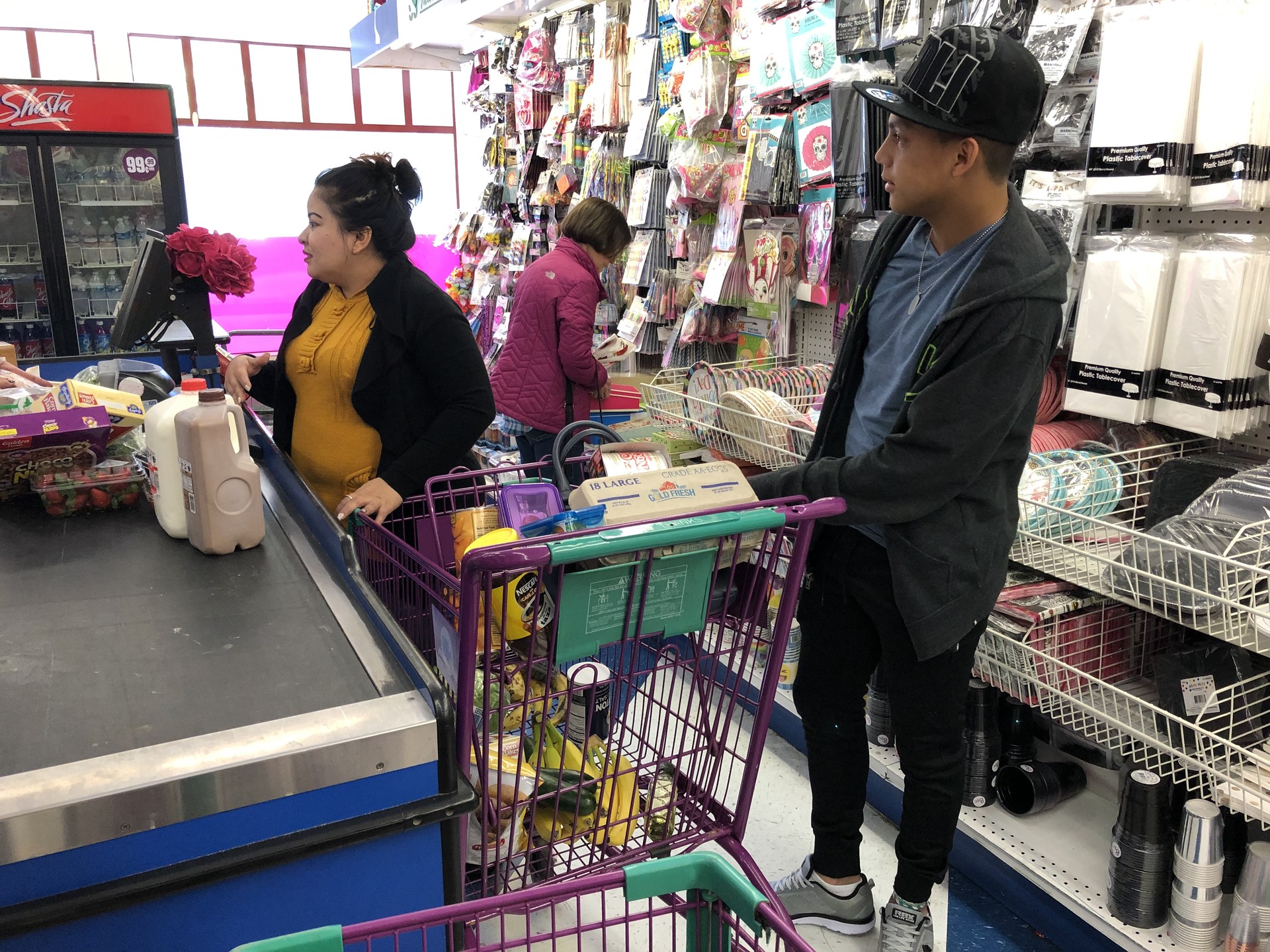 Veronica Aguilar, 36, and son Vladimir, 15, shop for groceries in Pinole. Vladimir spent two months at a shelter for unaccompanied youth in Florida before being released to his mother, who is also seeking asylum.