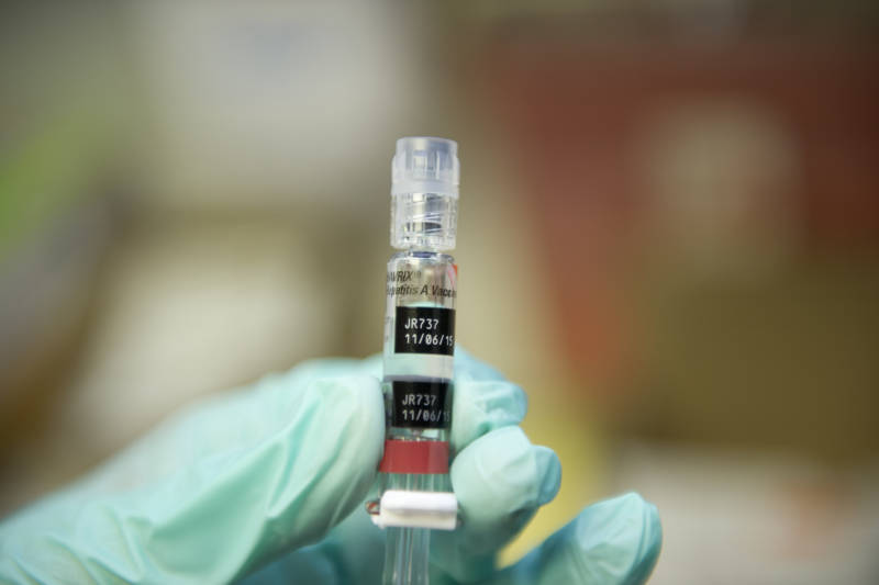 A nurse loads a syringe with a vaccine against hepatitis at a free immunization clinic for students before the start of the school year, in Lynwood on Aug. 27, 2013.