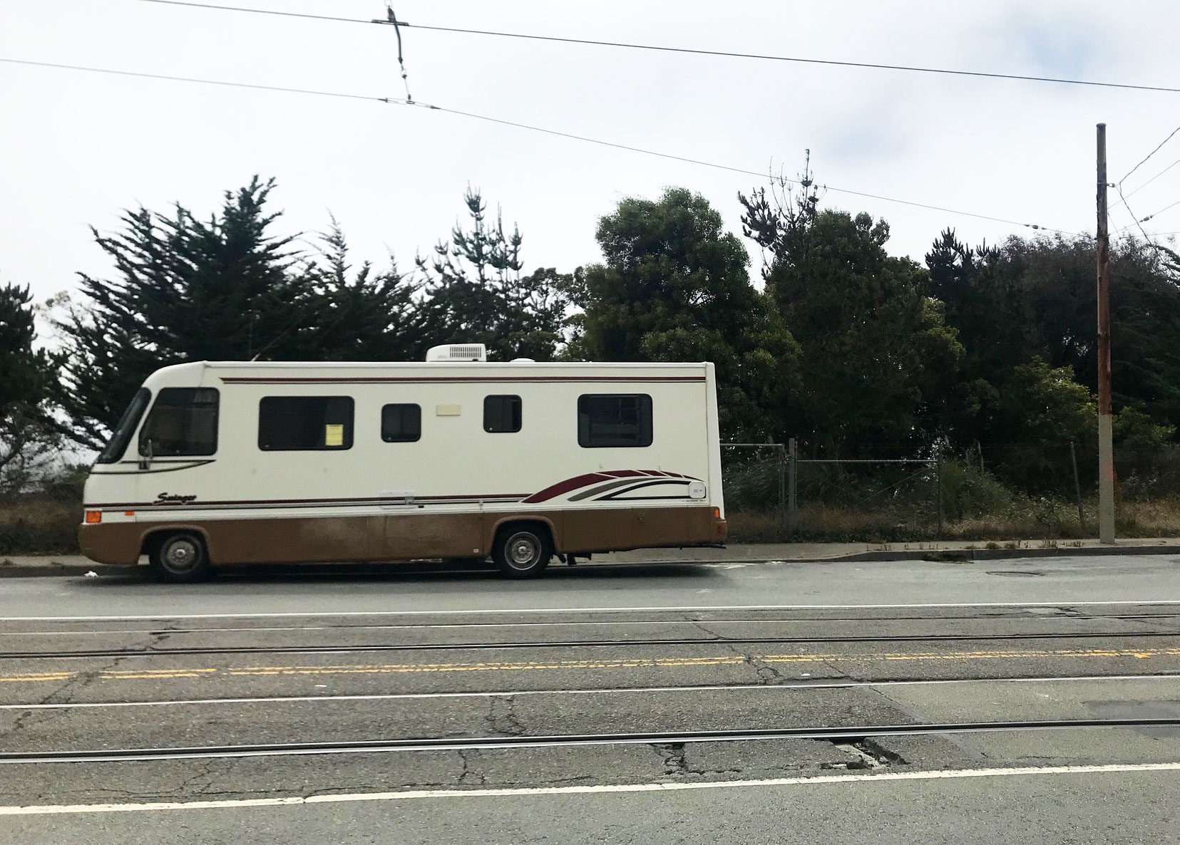 An RV is parked in Balboa Park up the street from San Francisco's first proposed safe parking lot, where people living in their vehicles would be able to park legally and access services.