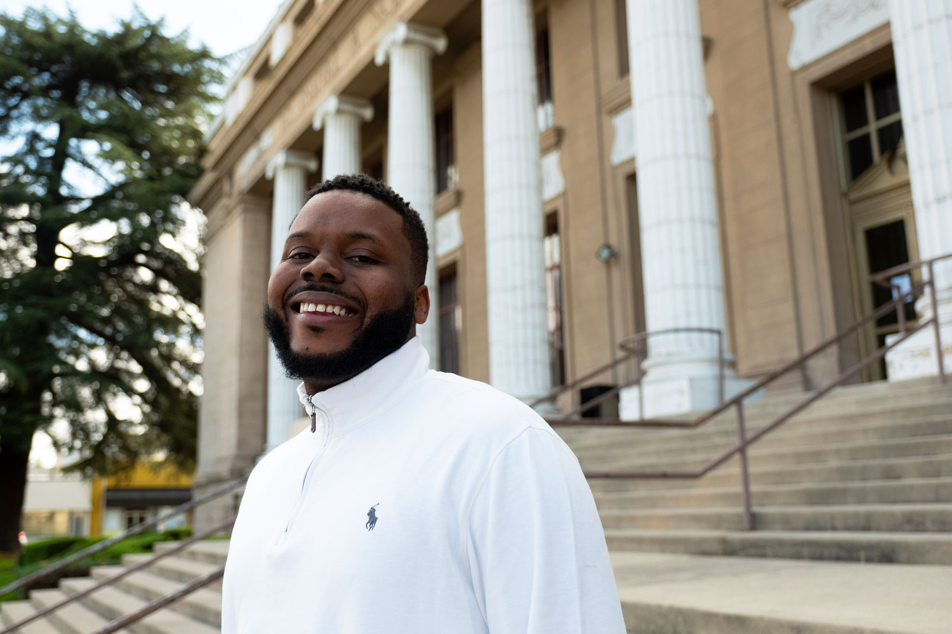 Stockton Mayor Michael Tubbs, 29, stands in front of City Hall. Soon his staff will move out to make way for new lofts and other downtown developments. Tubbs says the key to revitalizing the city is lifting people out of poverty.