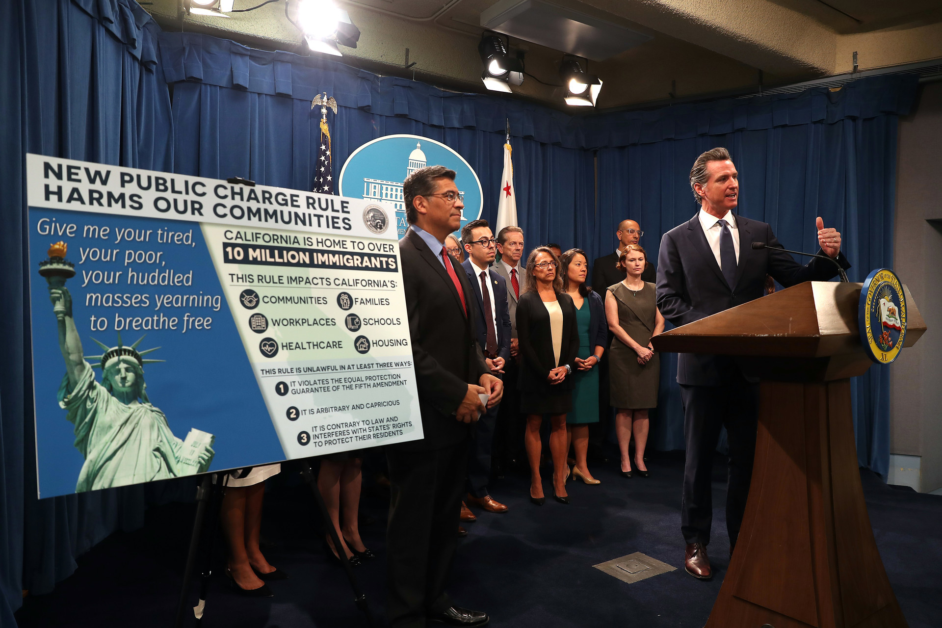 Gov. Gavin Newsom and Attorney General Xavier Becerra in August announcing a lawsuit against the Trump Administration&rsquo;s so-called &ldquo;public charge&rdquo; rule. A federal judge in California sided with them on Friday.