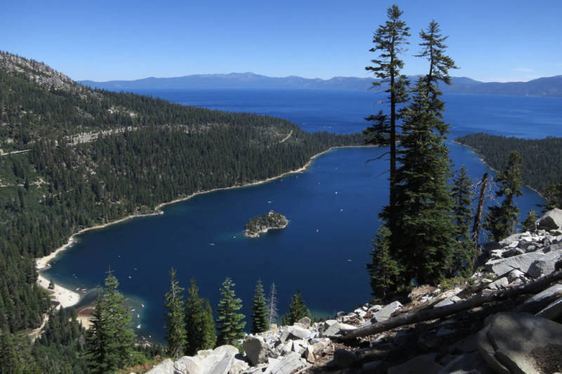 SOUTH LAKE TAHOE, CA - JULY 23: Emerald Bay lies under blue skies at Lake Tahoe on July 23, 2014 near South Lake Tahoe, California. Lake Tahoe is among Califonria's major tourist attractions.
