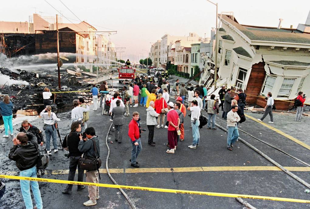 Firefighters extinguish fire in the Marina District in San Francisco in October 1989 after the Loma Prieta earthquake erupted in the city.