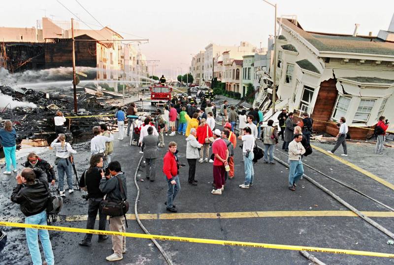 Firefighters extinguish fire in the Marina District in San Francisco in October 1989 after the Loma Prieta earthquake erupted in the city.