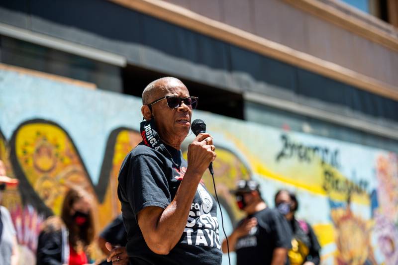 Addie Kitchen, the grandmother of Steven Taylor, speaks to a crowd in Oakland.