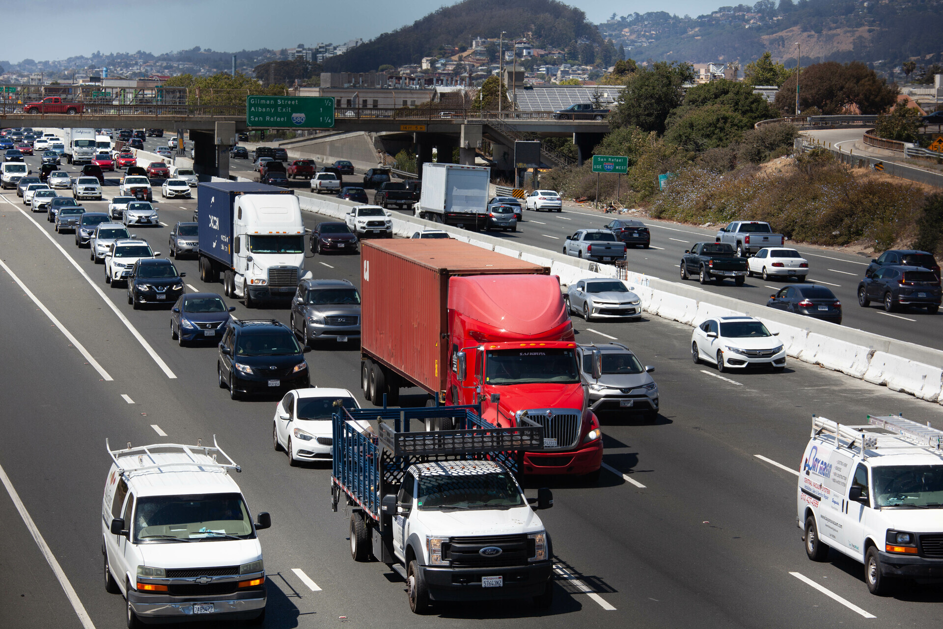 Cars and trucks fill the lanes on I-80 near Berkeley on June 28, 2021. A ban against heavy trucks on I-580, another freeway running through Oakland, pushes most diesel truck traffic onto I-880.