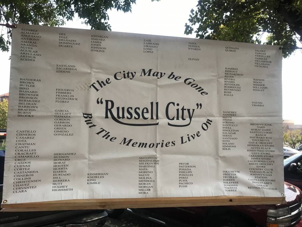 A board reads, "Russell City: The city may be gone, but the memories live on."