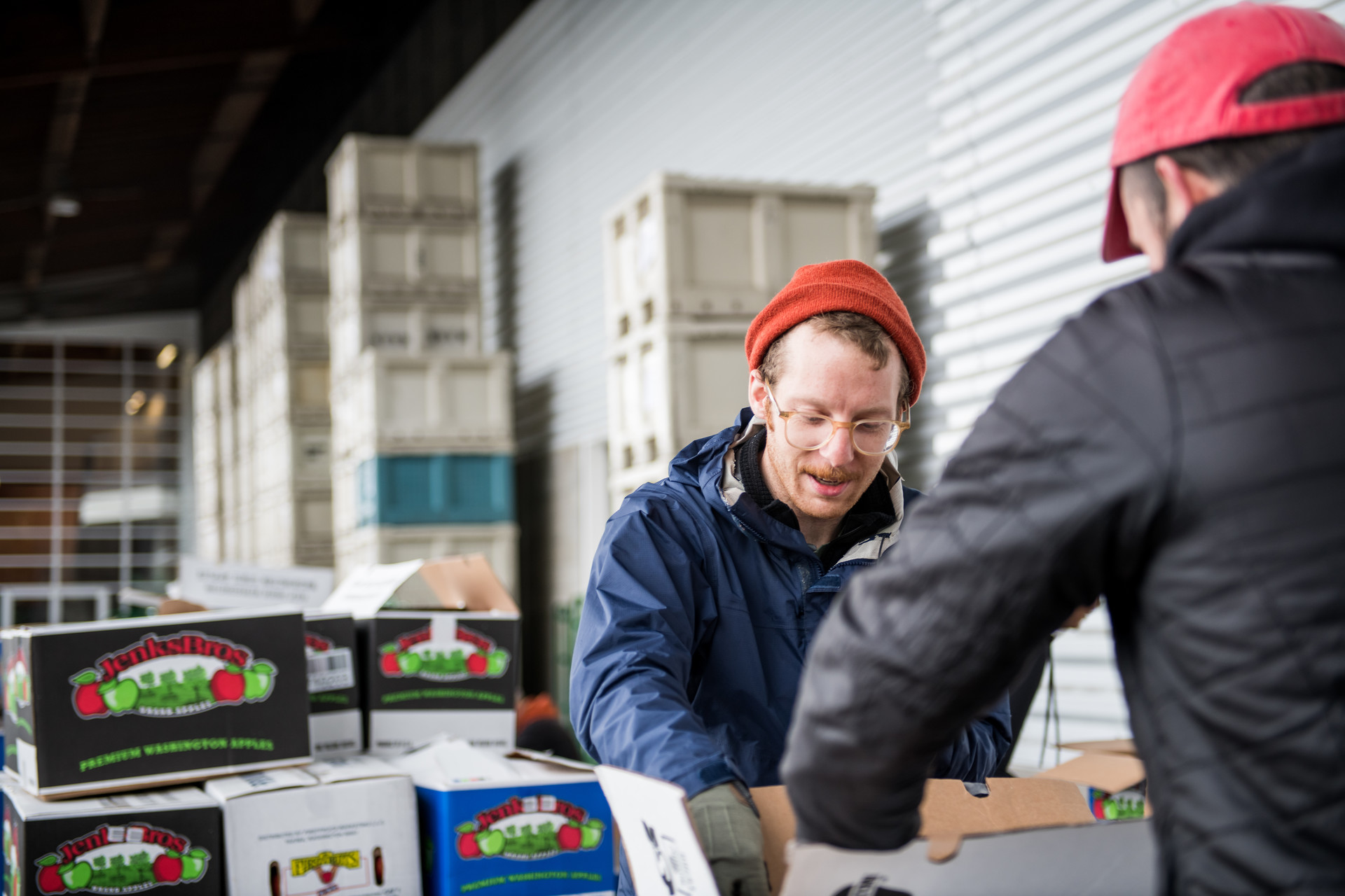 a volunteer sorts donated food for the SF Marin food bank