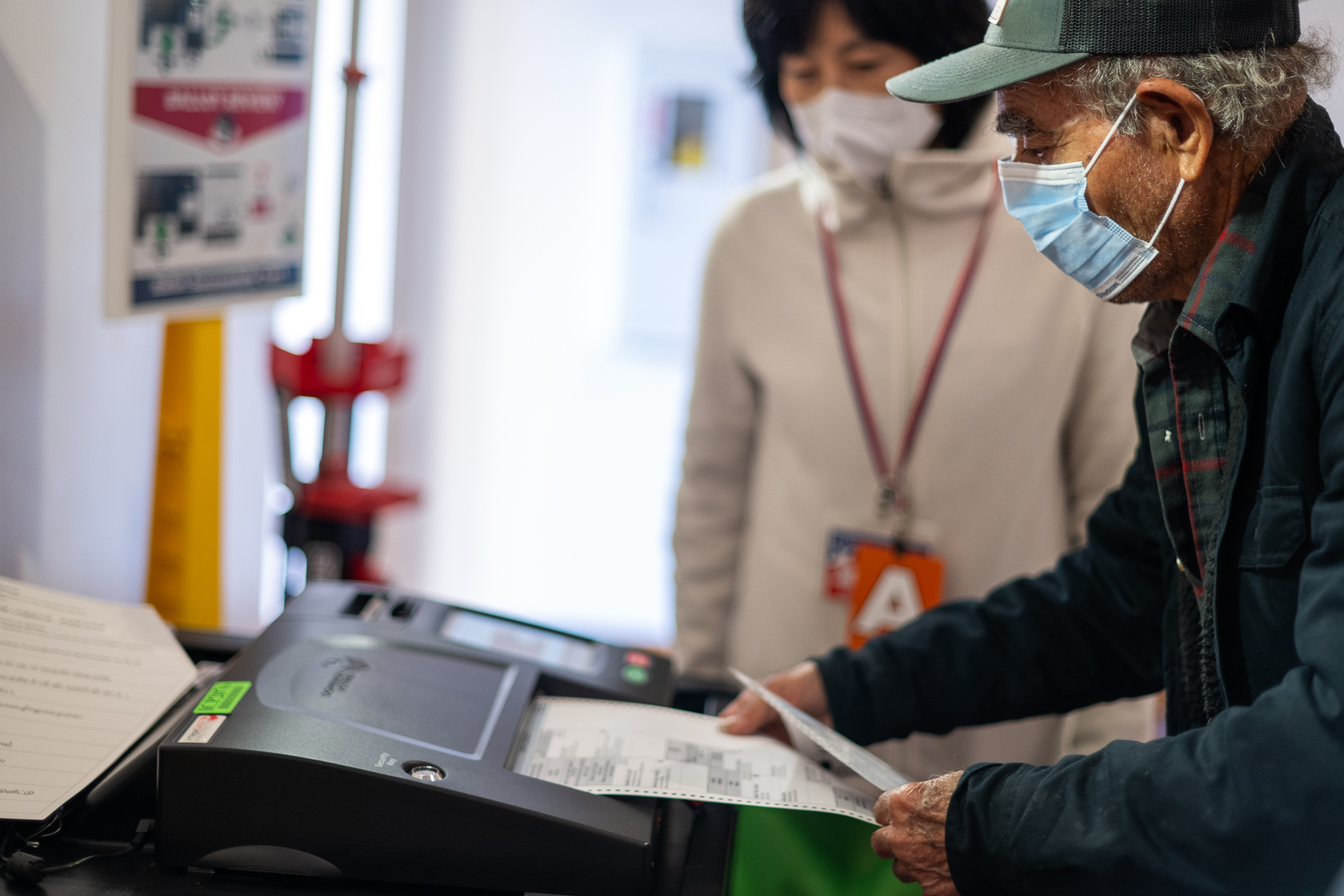 Voter submitting their ballot