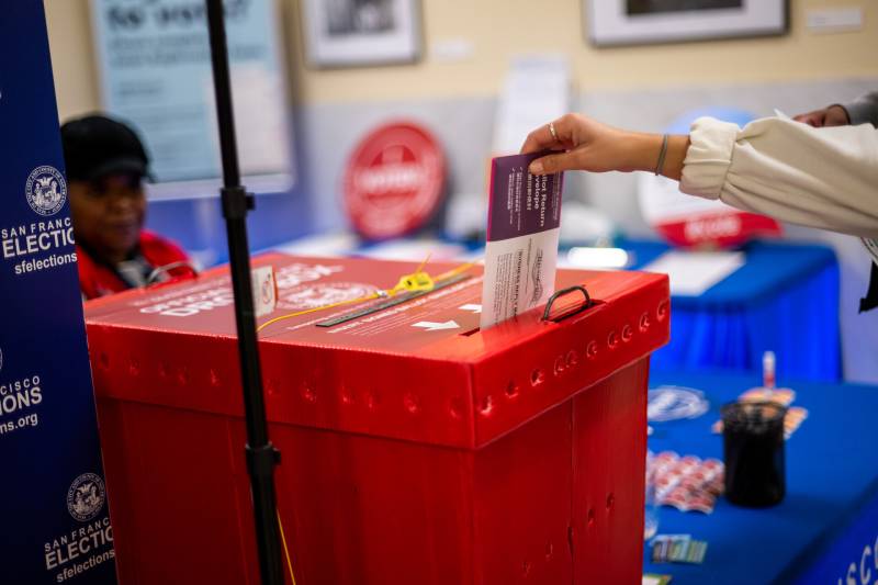 A voter seen dropping off a ballot.