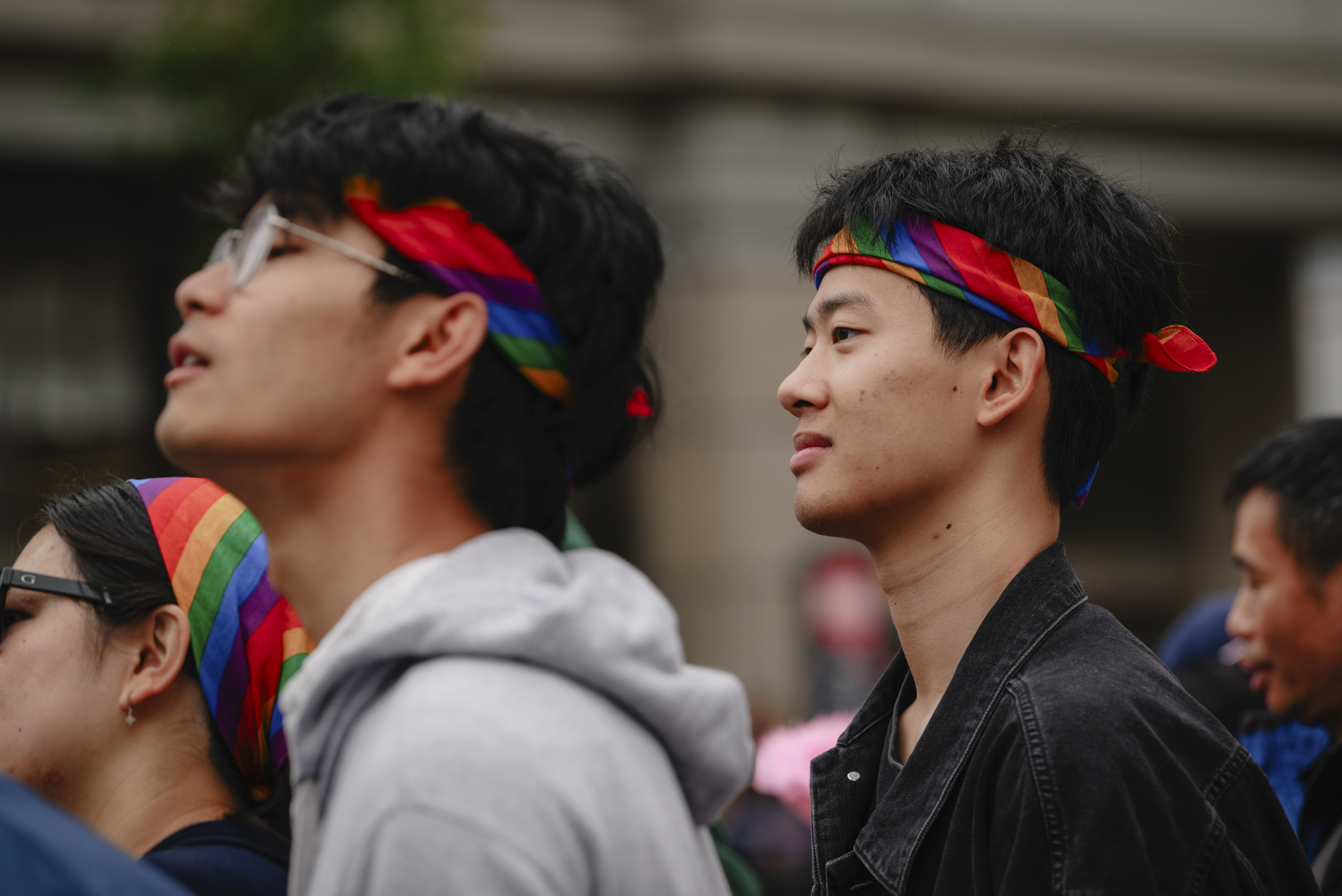 Wayne Shi, 23, of San Francisco waits for the Pride parade to begin in downtown San Francisco on June 25, 2023.