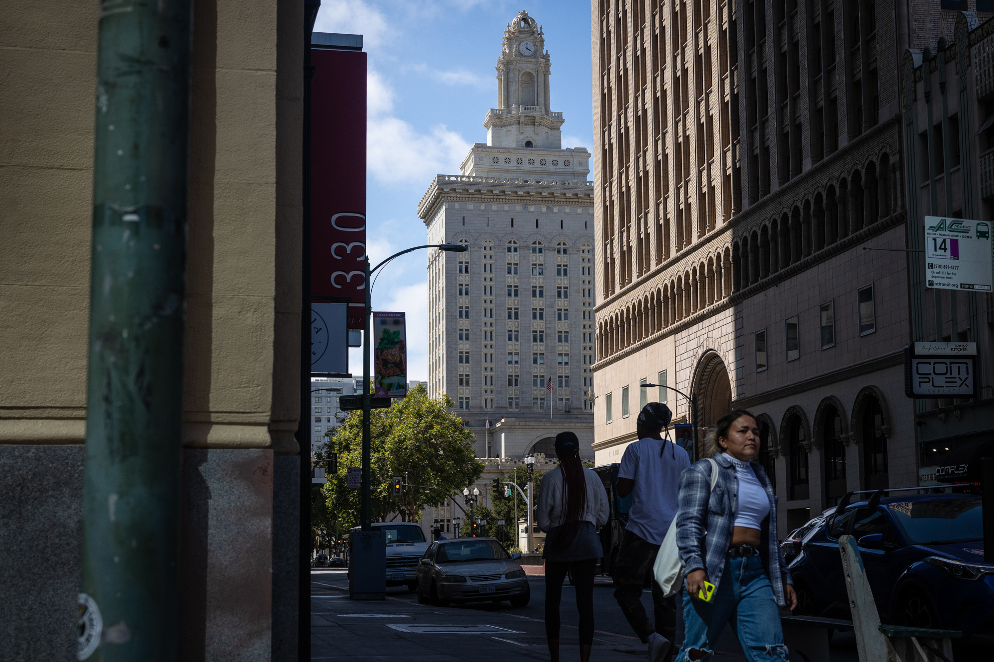 Oakland's City Hall is seen in between other tall buildings.