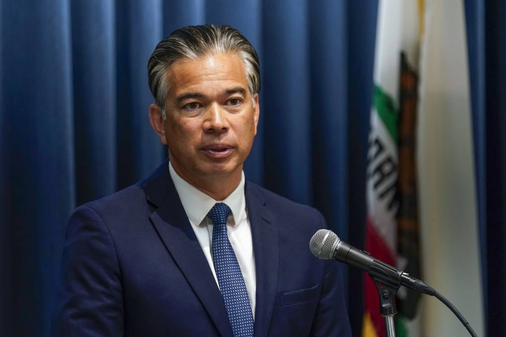 California's Attorney General Rob Bonta speaks into a microphone.