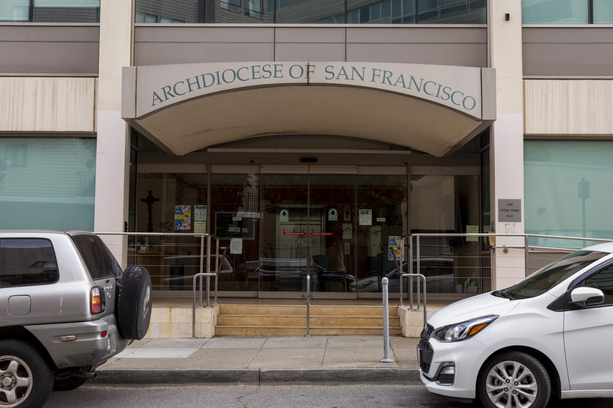 A building on a city street with the words "Archdiocese of San Francisco" written over the entrance.
