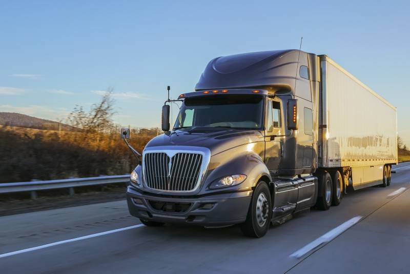 A semitrailer on a freeway.
