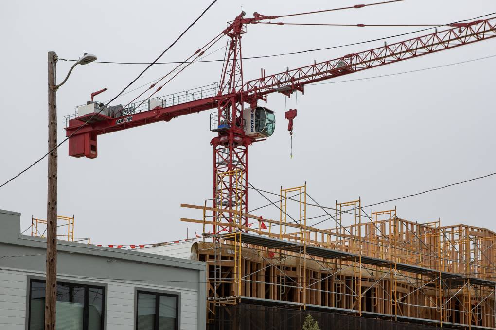 A construction crane over a building.