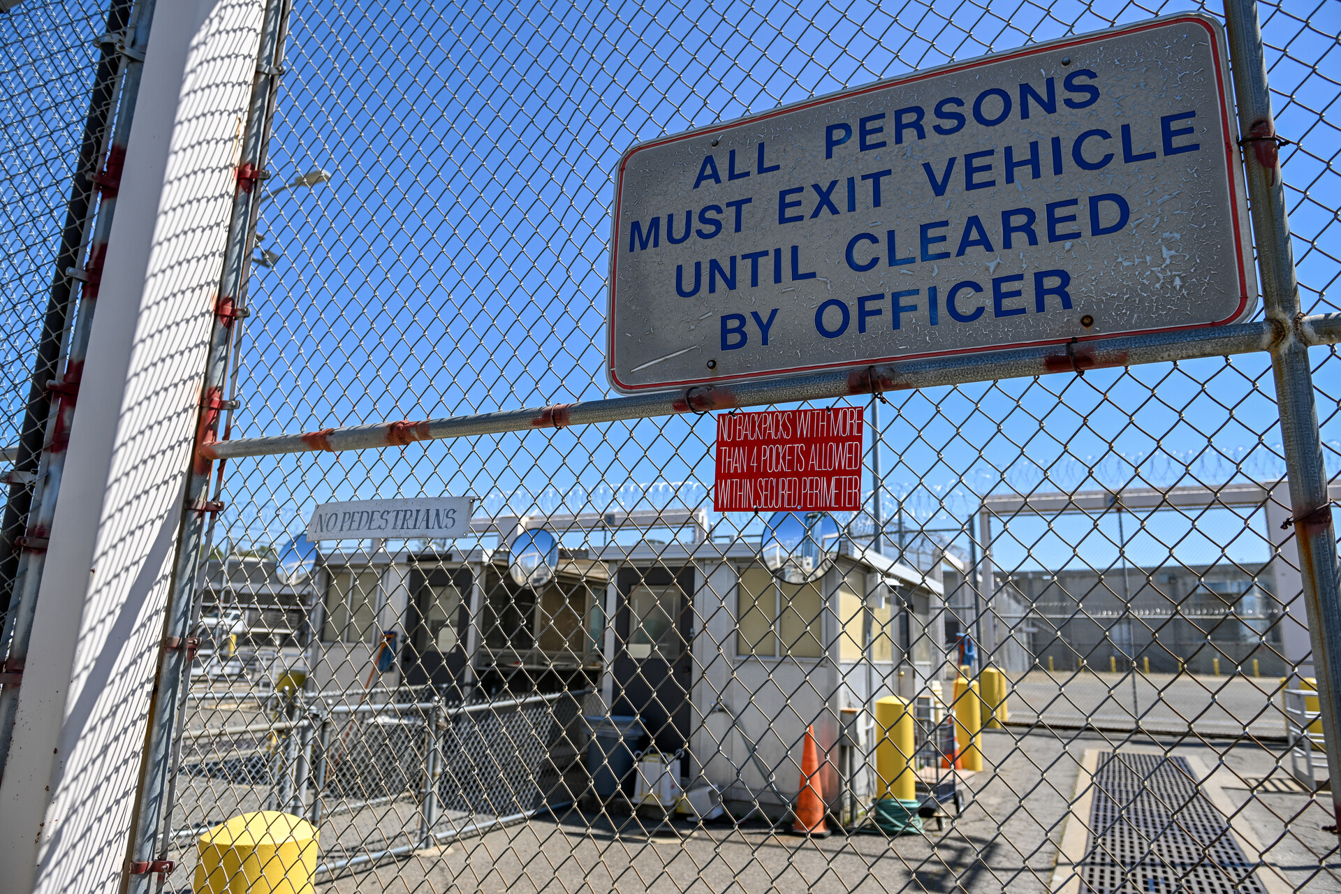 A sign at Folsom Prison reads, "All Prisoners Must Exit Vehicle Until Cleared By Officer."
