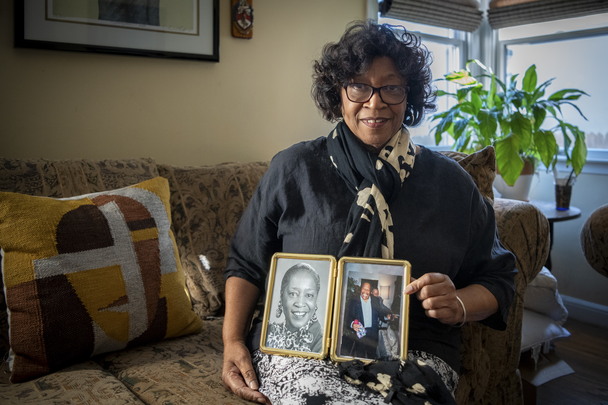 Gloria Brown holds a photo of her and her late husband, Arthur Brown in her home on in San Mateo on Nov. 3, 2023.