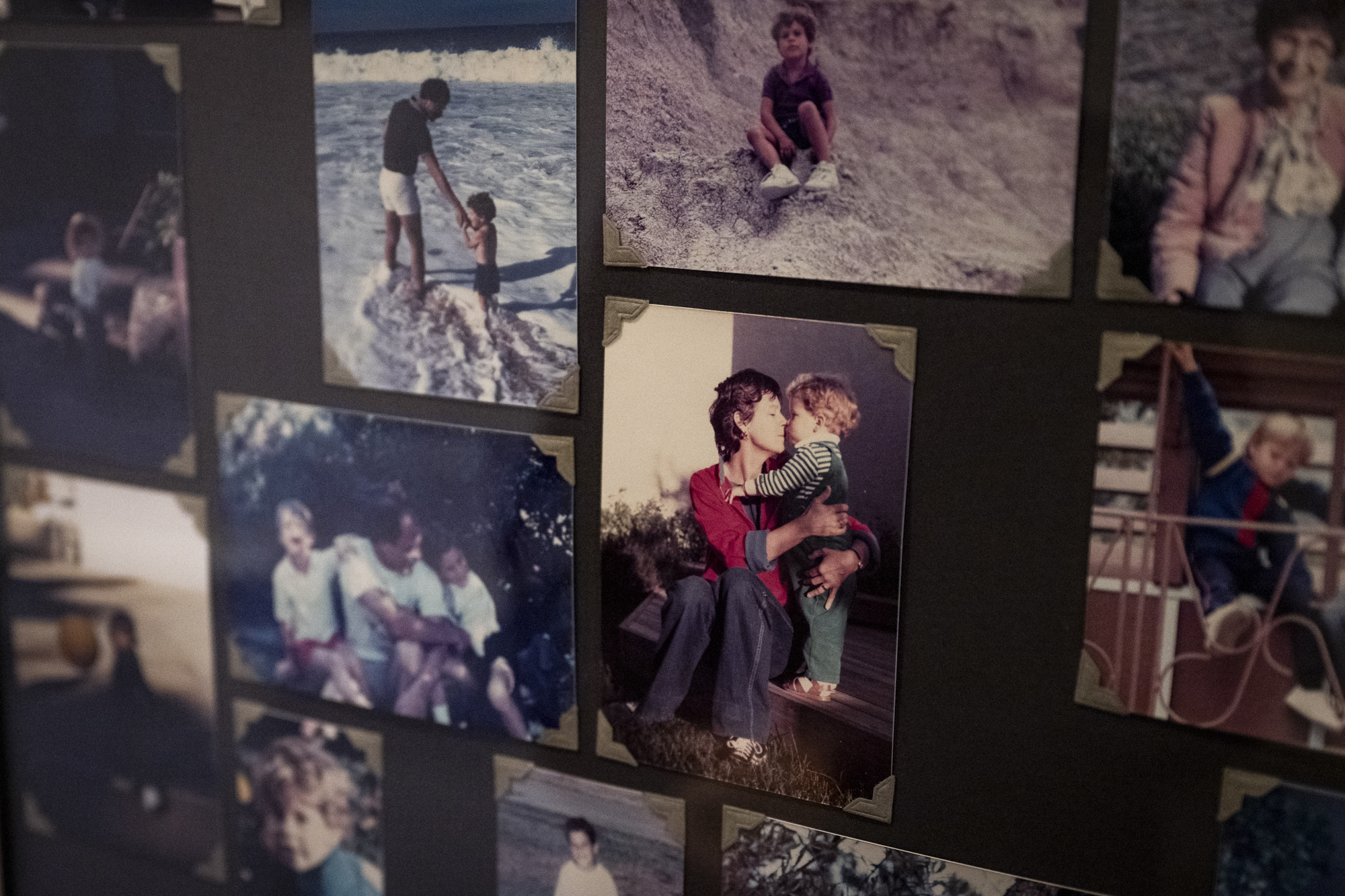 Old photos of a mother and son on a wall. 