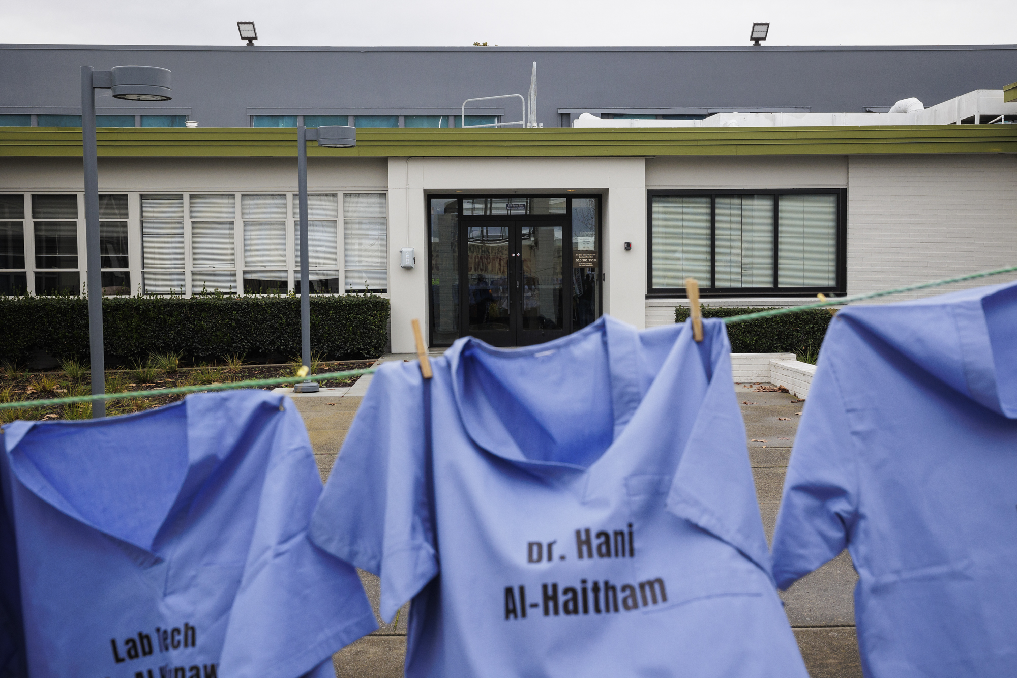The names of healthcare workers killed in Gaza are printed on scrubs hung in front of the L3 Harris office in San Leandro on Jan. 24, 2024.