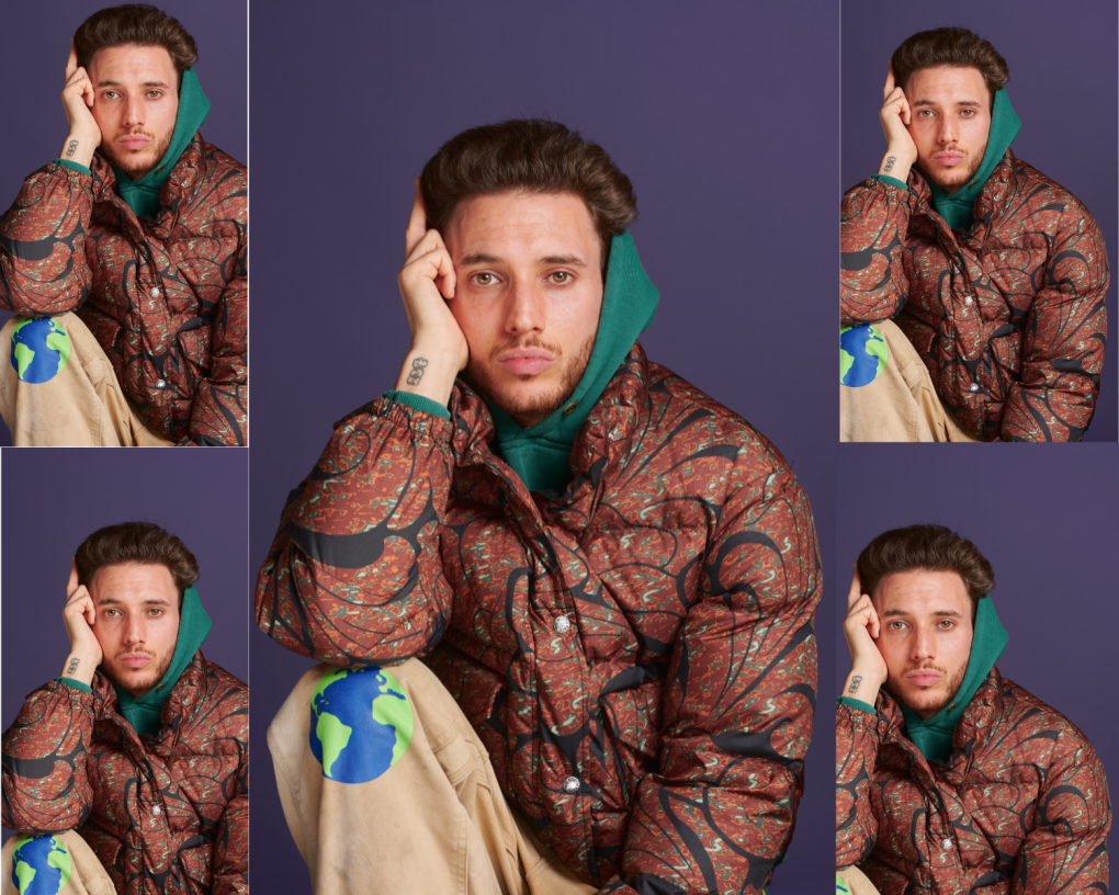 A photo collage of 5 images of a man wearing a red and brown jacket with designs and a green hoodie who is resting his arm on his knee and hand on his face.