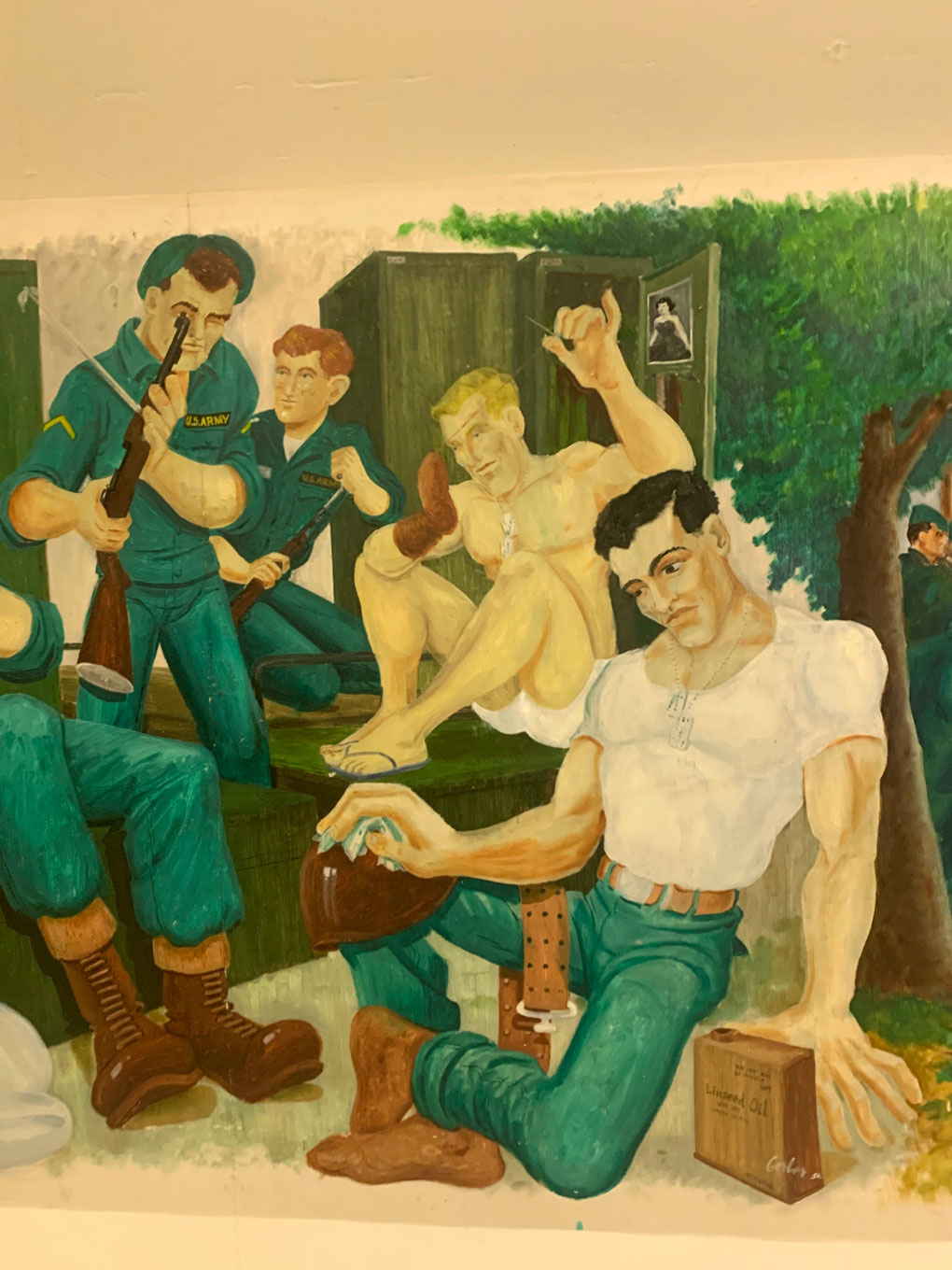 Stylized painting of five soldiers hanging out in a locker room joking around.