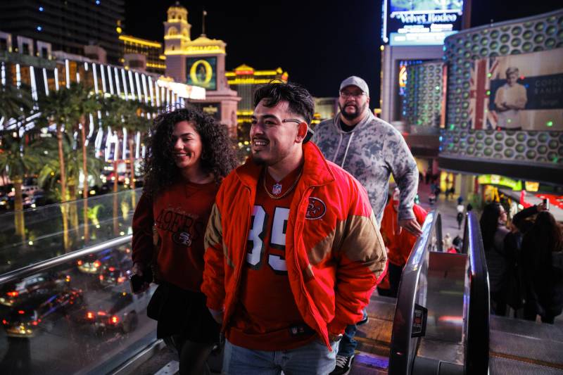 49ers fans walk the Las Vegas Strip.