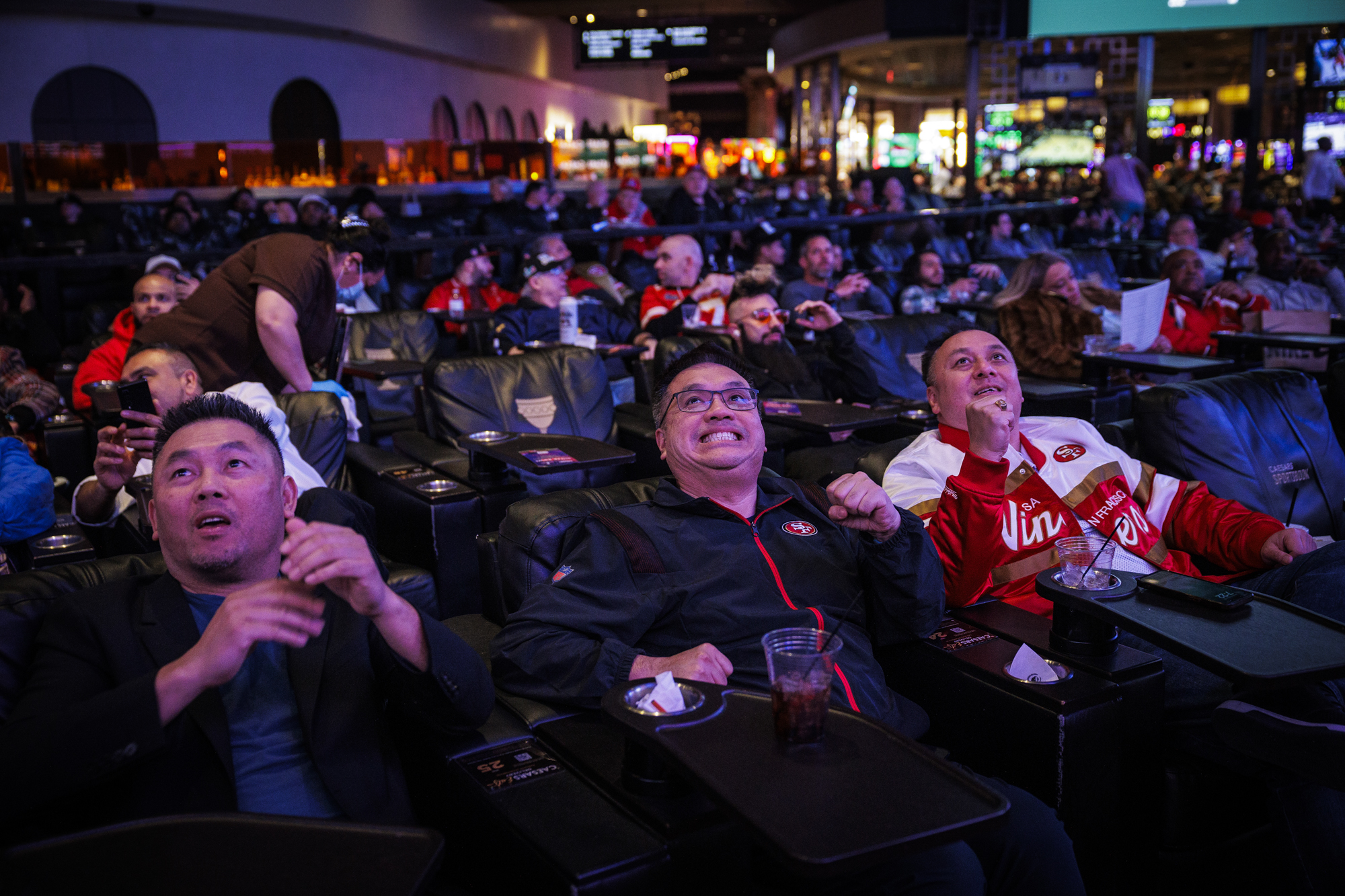 Adam Bui, Tony Lam, Toddy Su watch the Golden State Warriors play at Caesars Sportsbook in Las Vegas on Feb. 10, 2024.