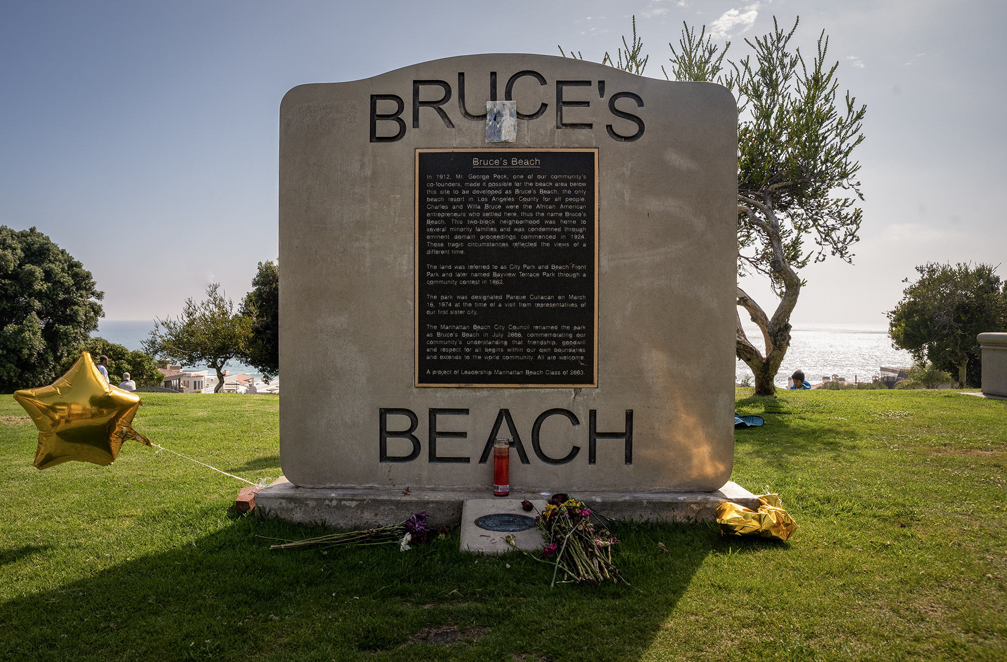 A memorial stone plaque reads "Bruce's Beach."