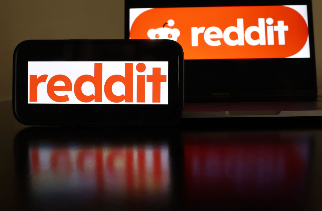Two red signs that say "Reddit."