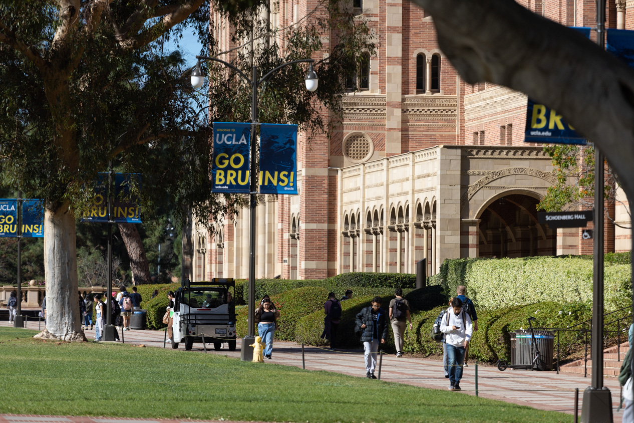 A view of a campus with people walking around.
