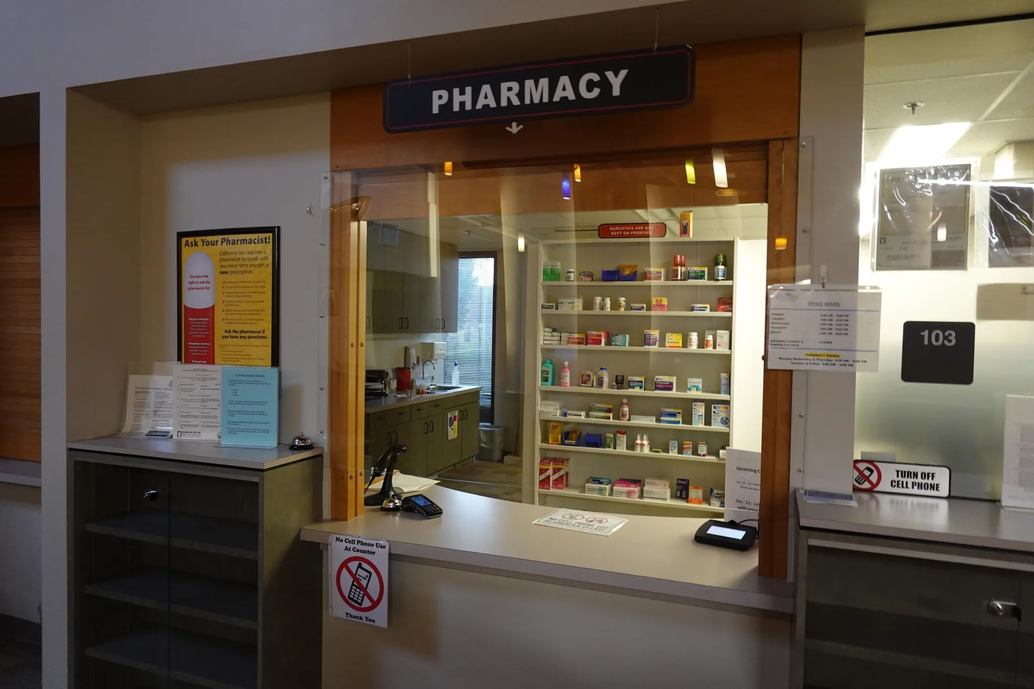A view of a pharmacy with nobody behind the counter.