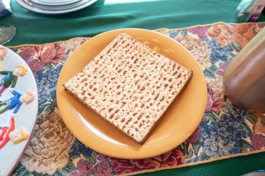 A plate of matzo on a Passover seder table.