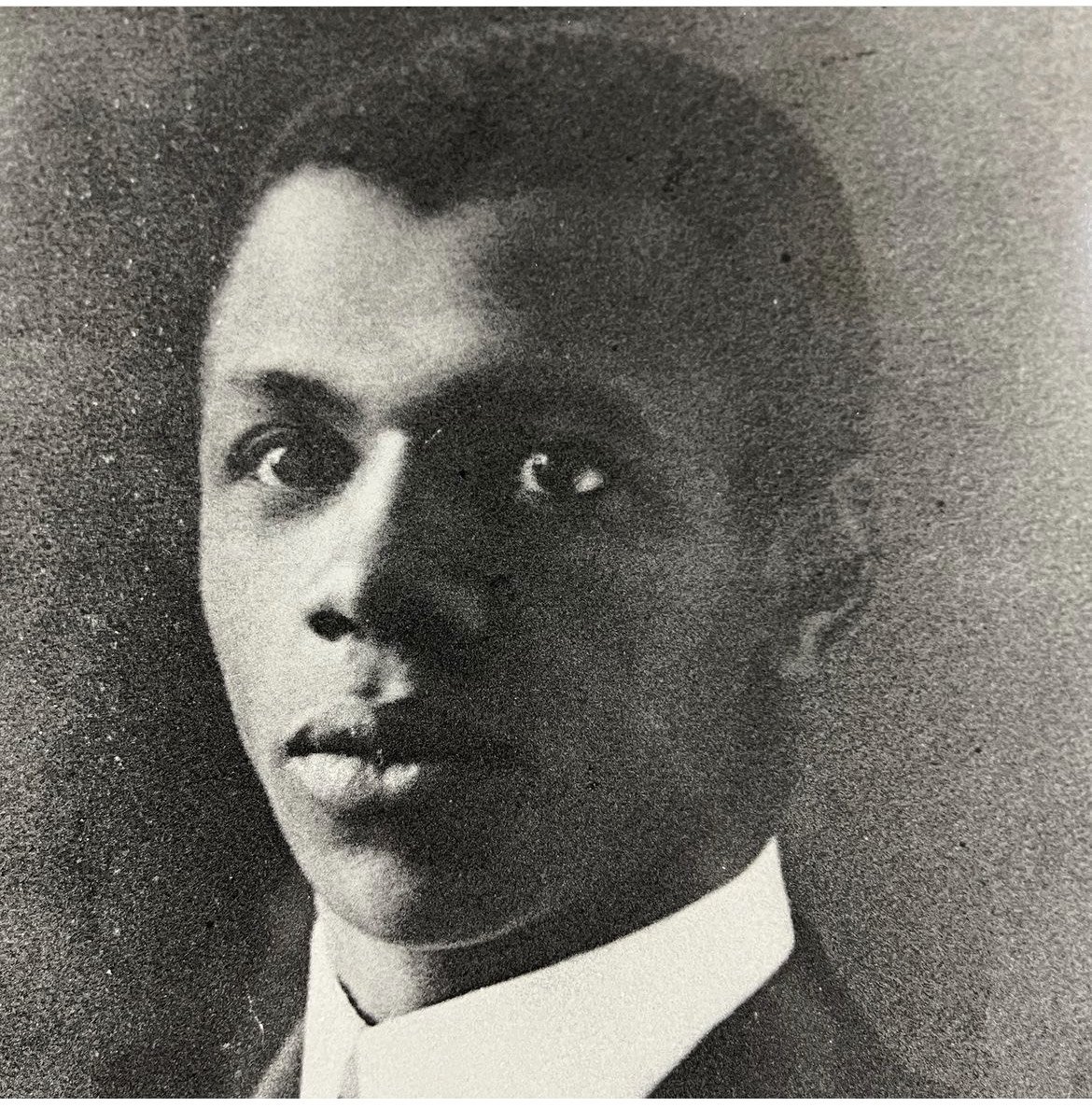 Black and white portrait of a young black man.