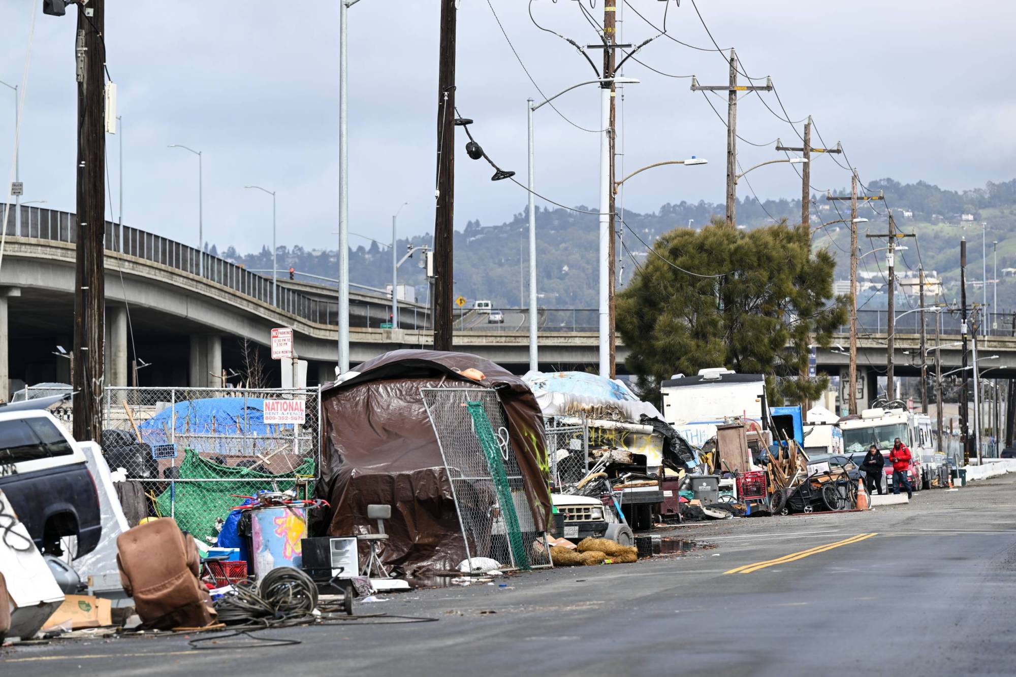 Tents line a city street.
