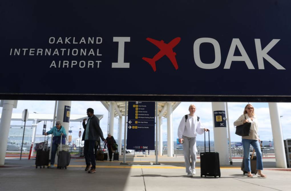 A sign at the airport that reads "I [heart] OAK."