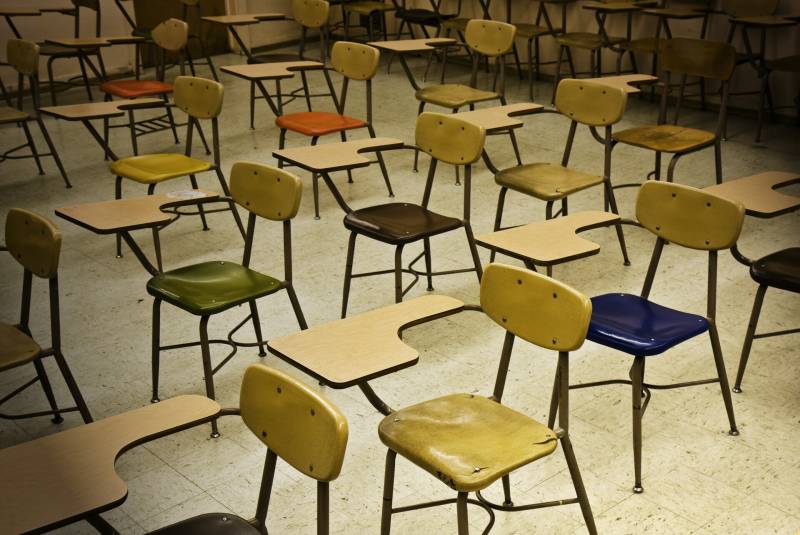 Colorful chairs in an empty classroom.
