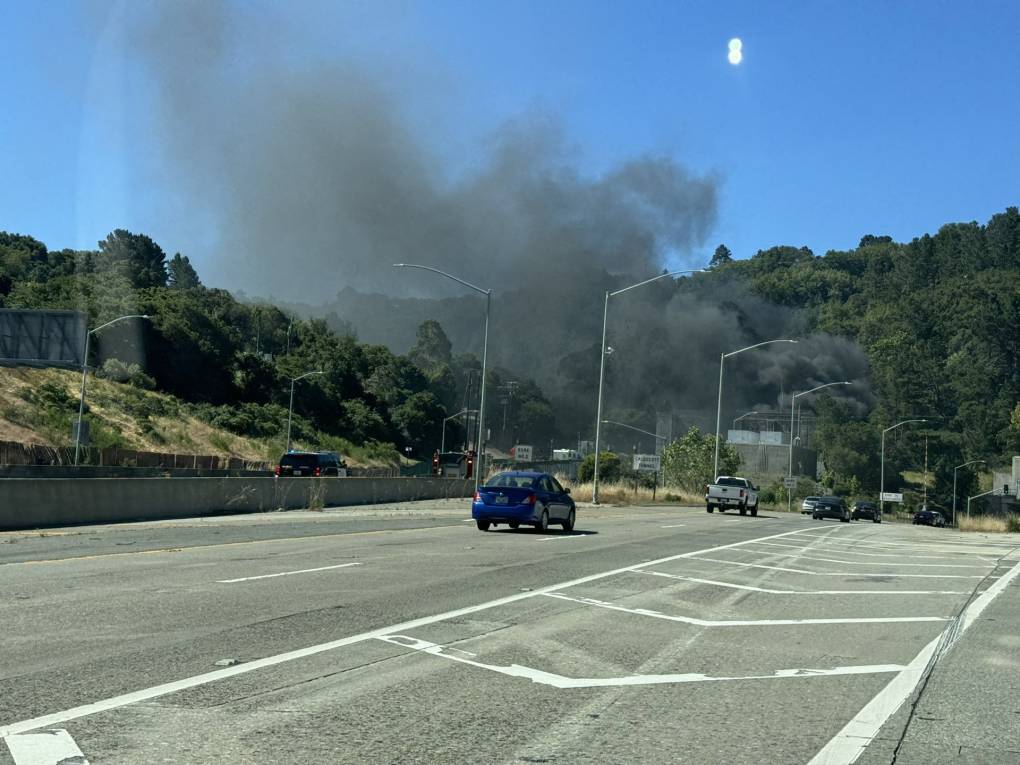 Smoke rises from a highway tunnel.