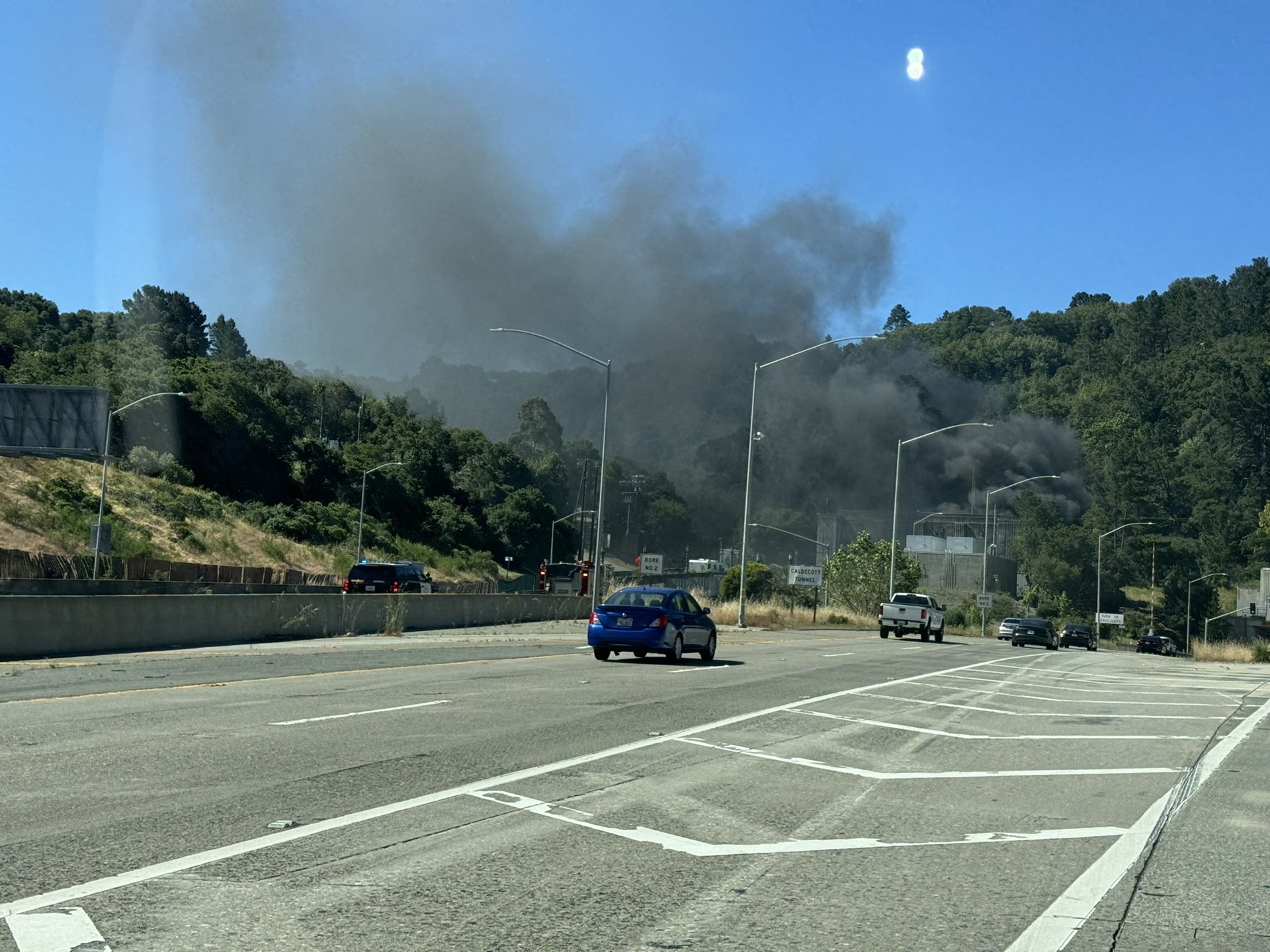 Smoke rises from a highway tunnel.