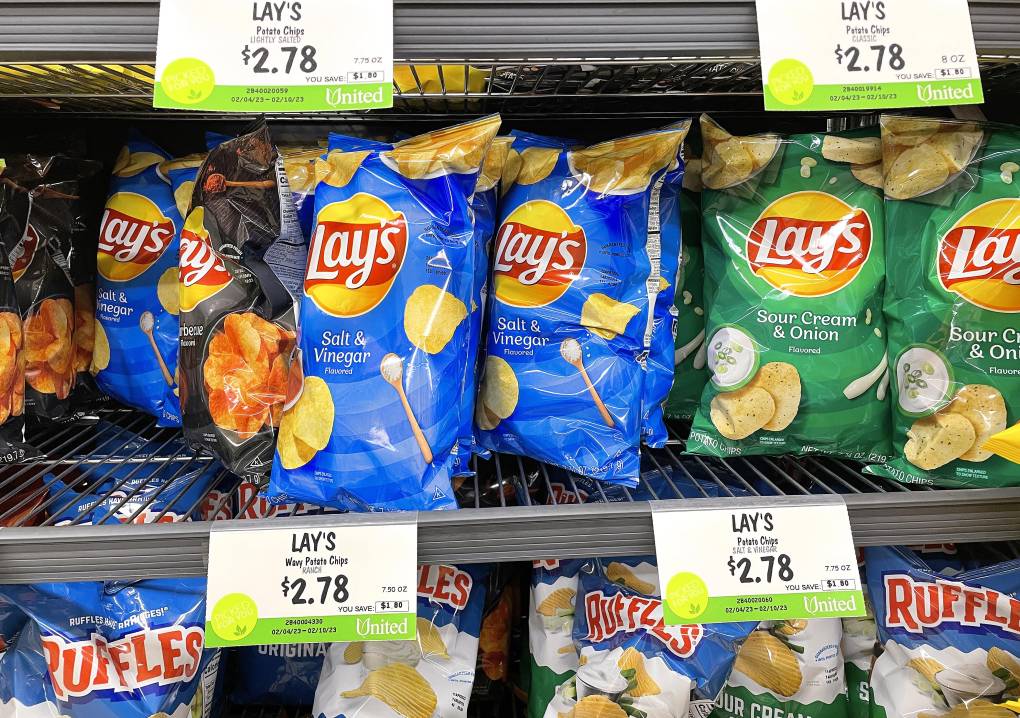 Sale priced bags of Lay's potato chips.