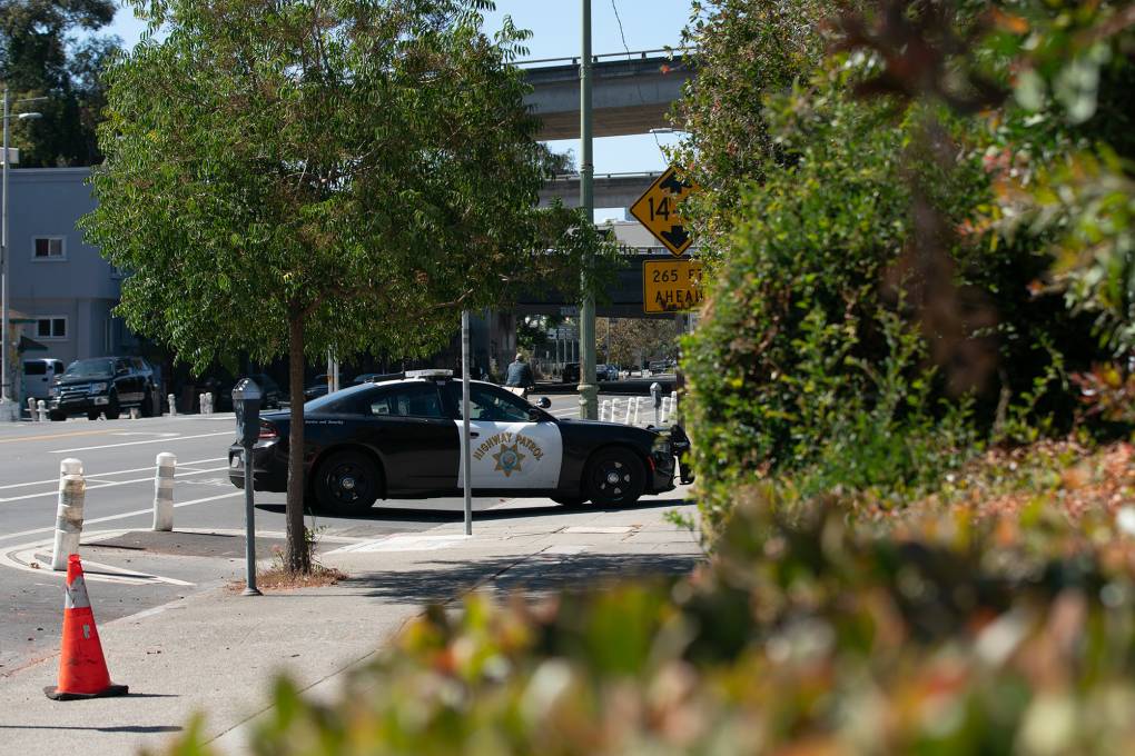 A police vehicle parked on the street that says "Highway Patrol" on the side.