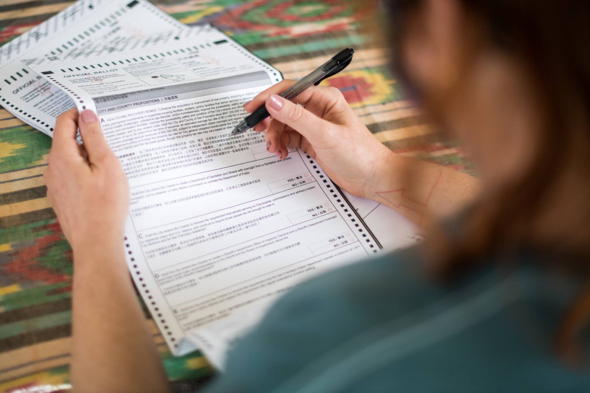 A San Francisco resident fills out their mail-in ballot. Beth LaBerge/KQED