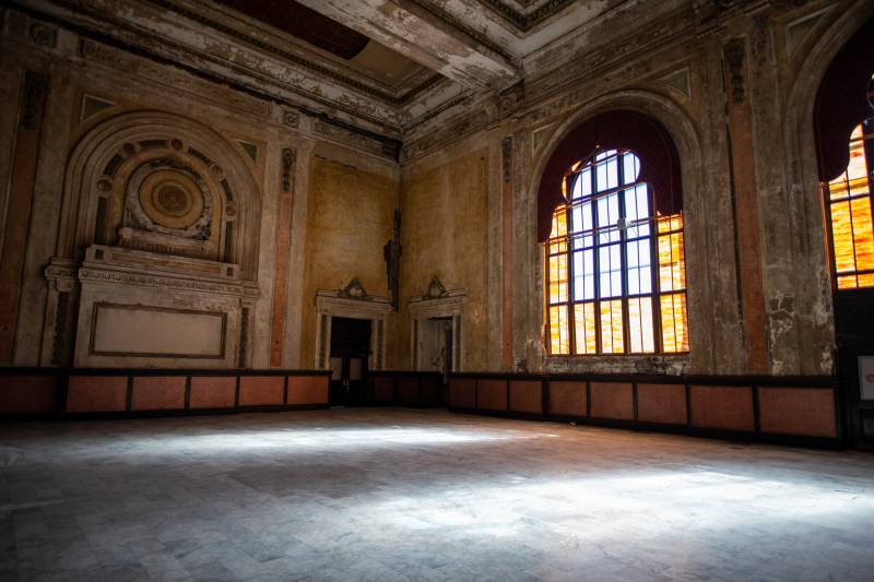 The interior hall of an abandoned building.